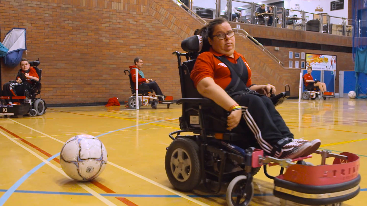 Cath playing powerchair football