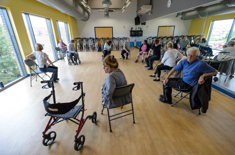 Group of disabled and non-disabled people taking part in movement and strength exercise class. Photo credit: Sport England