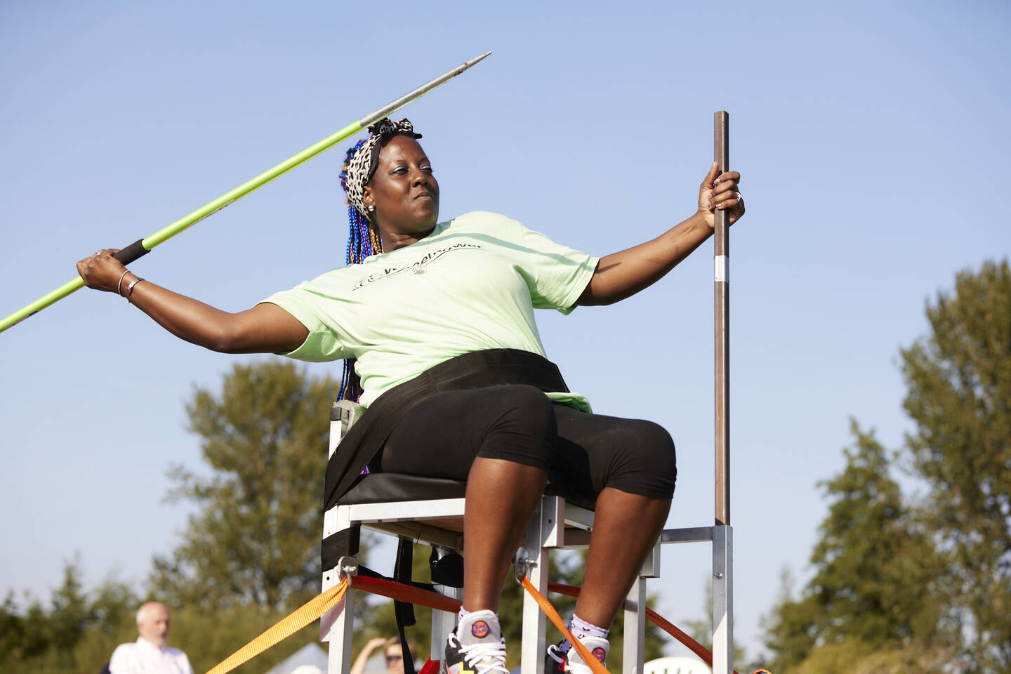 Disabled woman taking part in seated javelin 