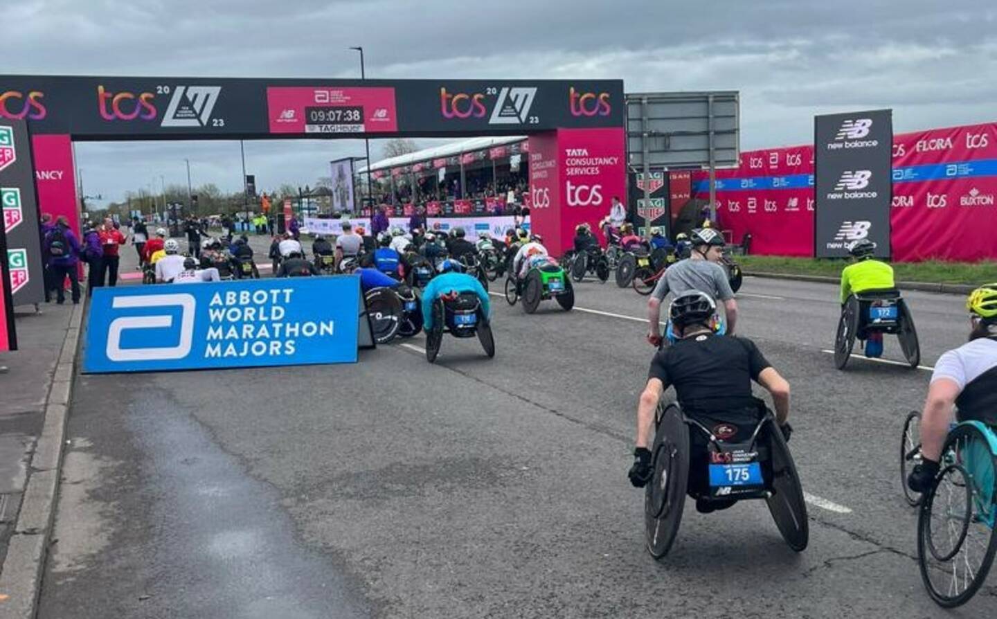 Wheelchair racers move away from the start line of the London Marathon.
