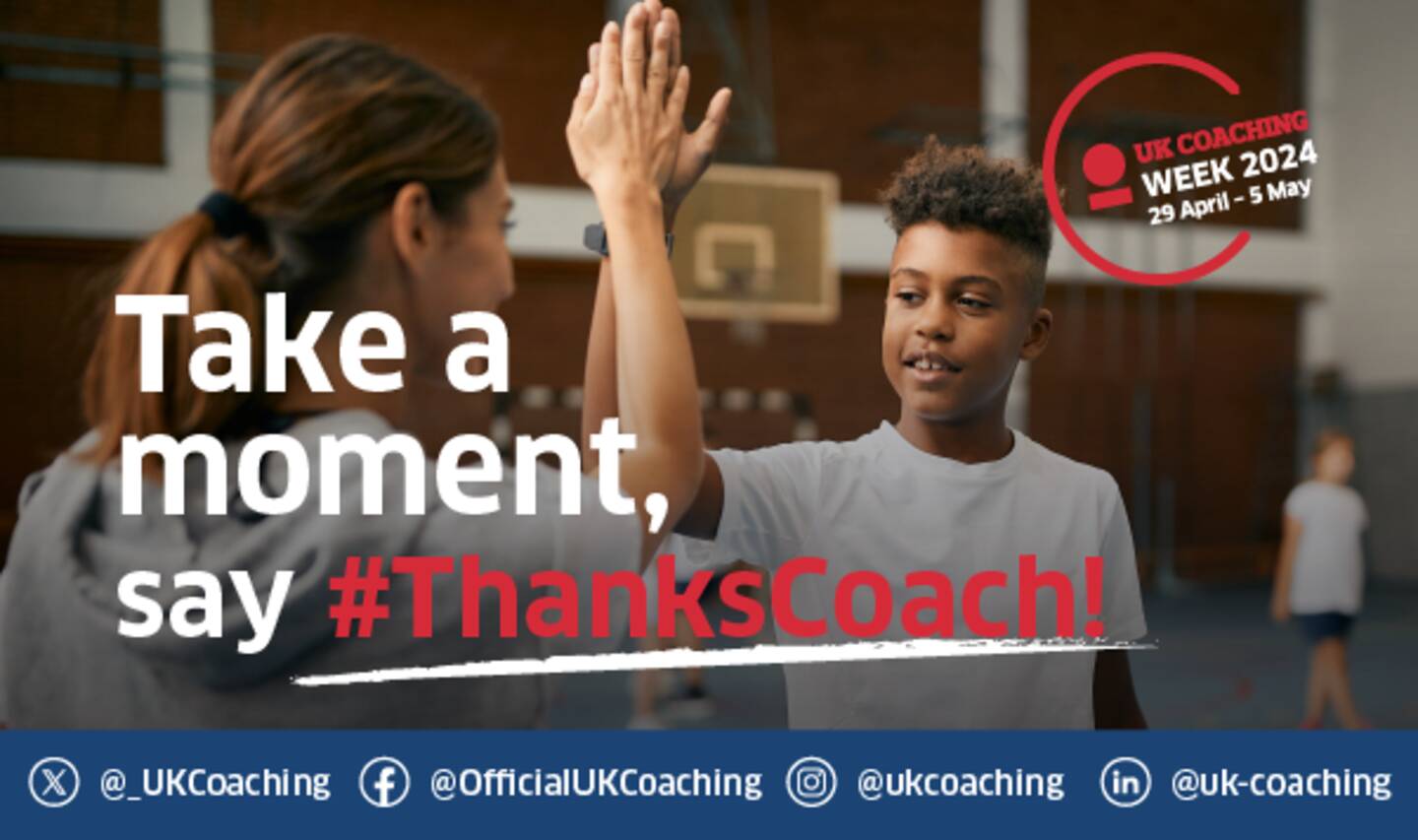 A image of a young boy 'high-fiving' his coach. There is a basketball court in the background. The text over the image says 'Take a moment, say #ThanksCoach!