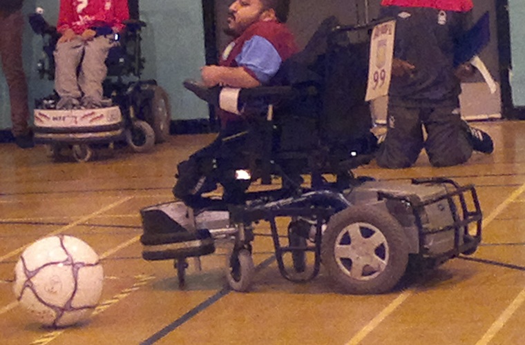 Amir Ali playing powerchair football