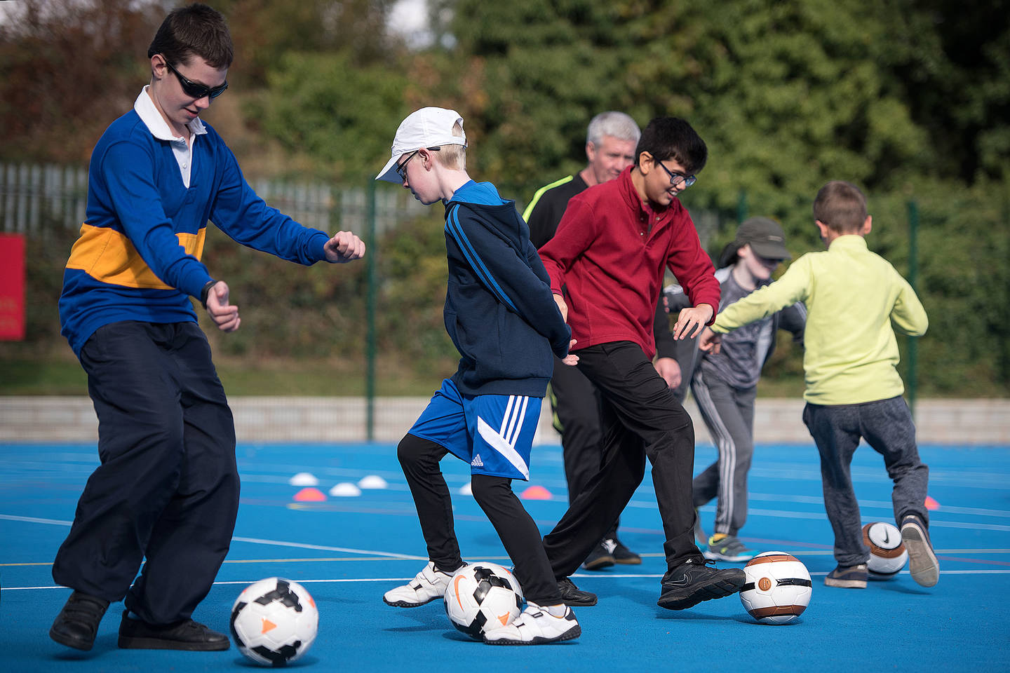 Group of boys with visual impairments taking part in football drills. Photo credit: British Blind Sport