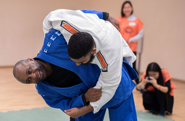 Two men with visual impairments taking part in judo. Photo credit: British Blind Sport