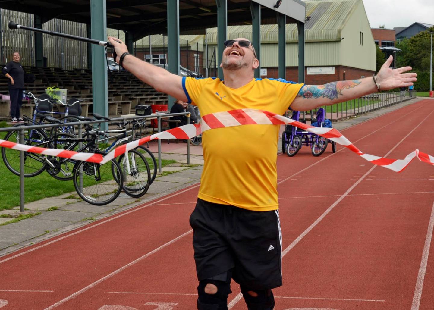 Tim crossing the finish line