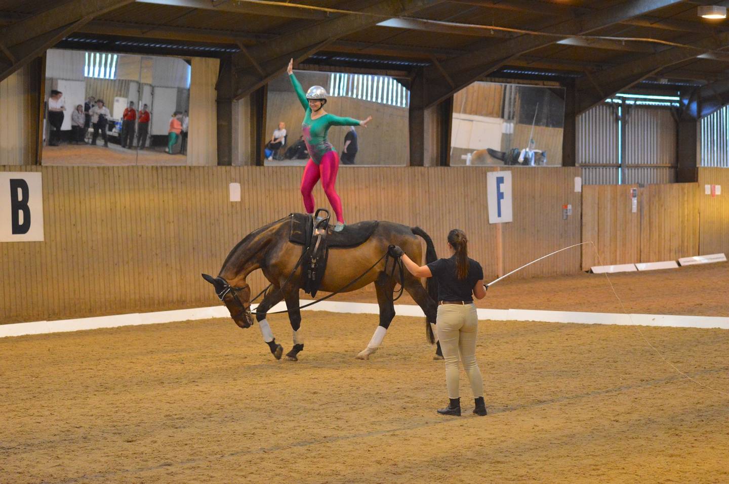 Lizie Bennett performing vault move on horseback