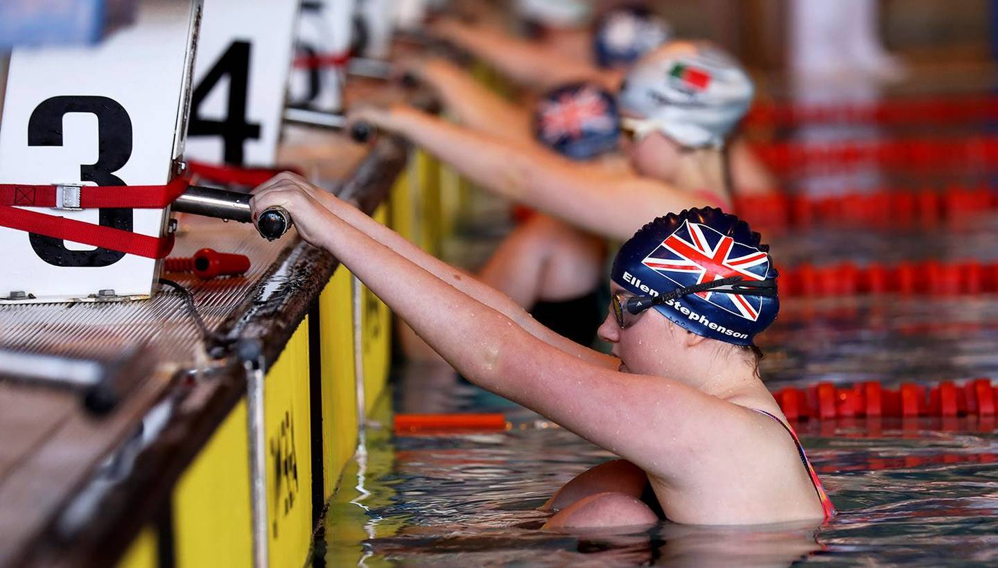 Ellen Stephenson in pool ready to swim in a race.  