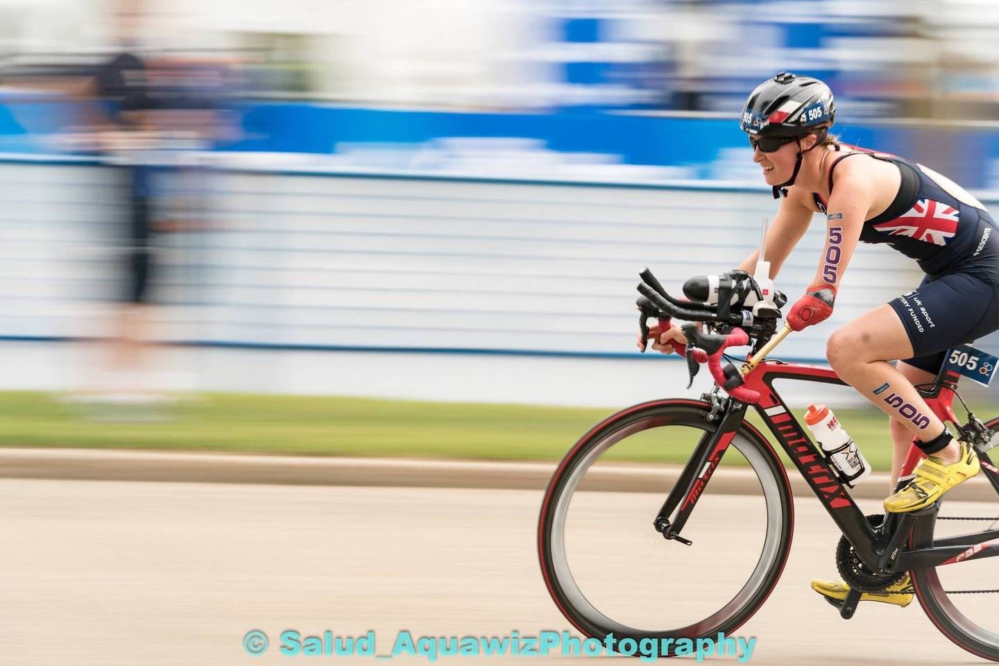 Claire Cashmore on bike in Triathlon