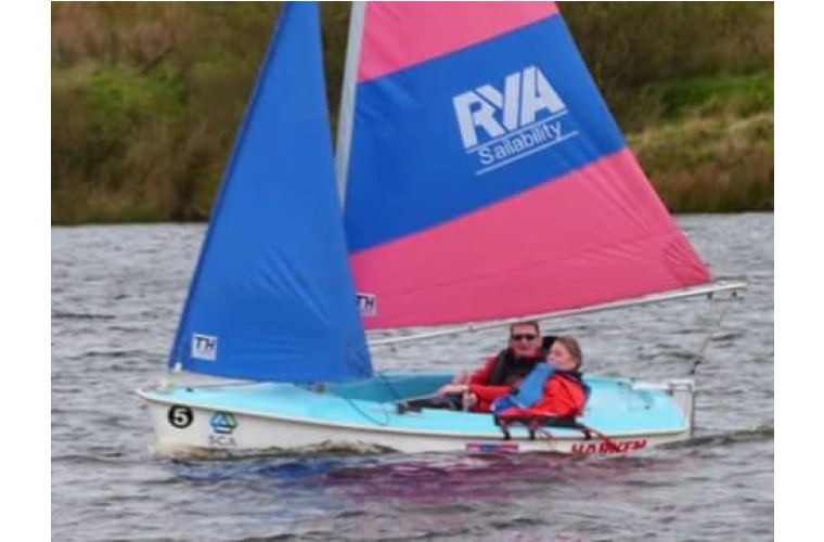 Hannah out on the water at Sailability session