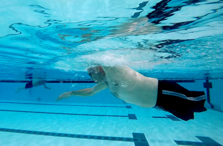 Anthony swimming underwater at Manchester Aquatics pool 