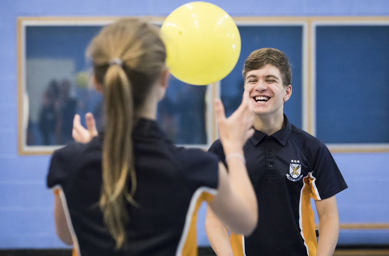 Two school children taking part in inclusive PE lesson