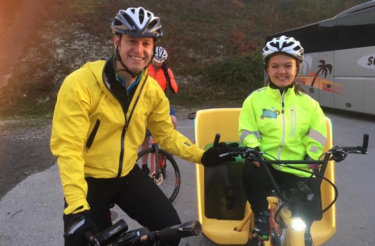 Maisie and Matt Baker smiling on Rickshaw bike