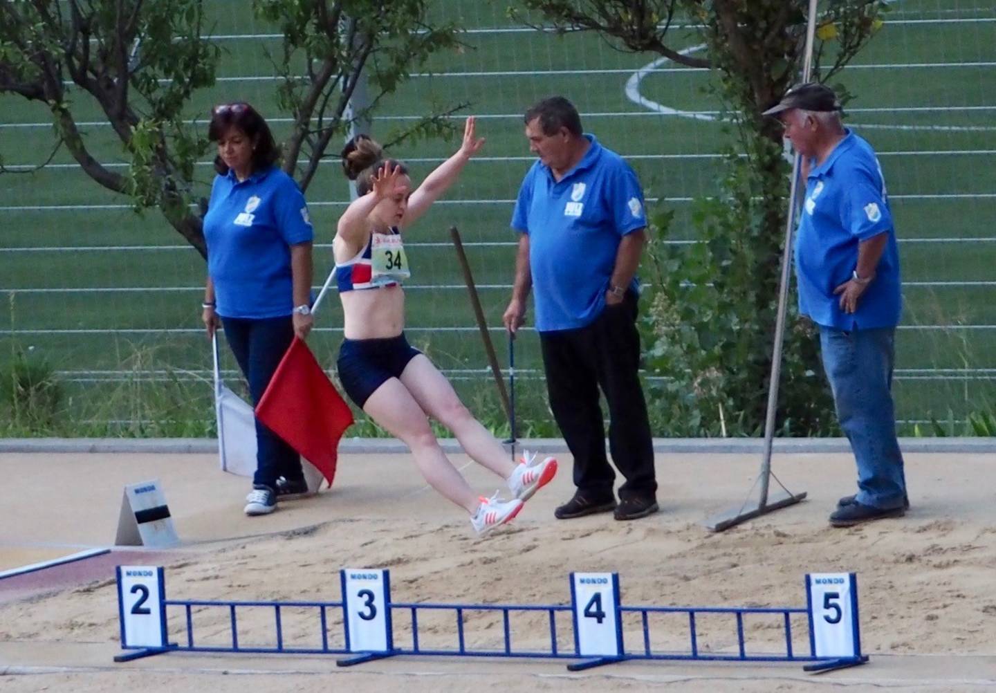 Charlotte doing a long jump. 