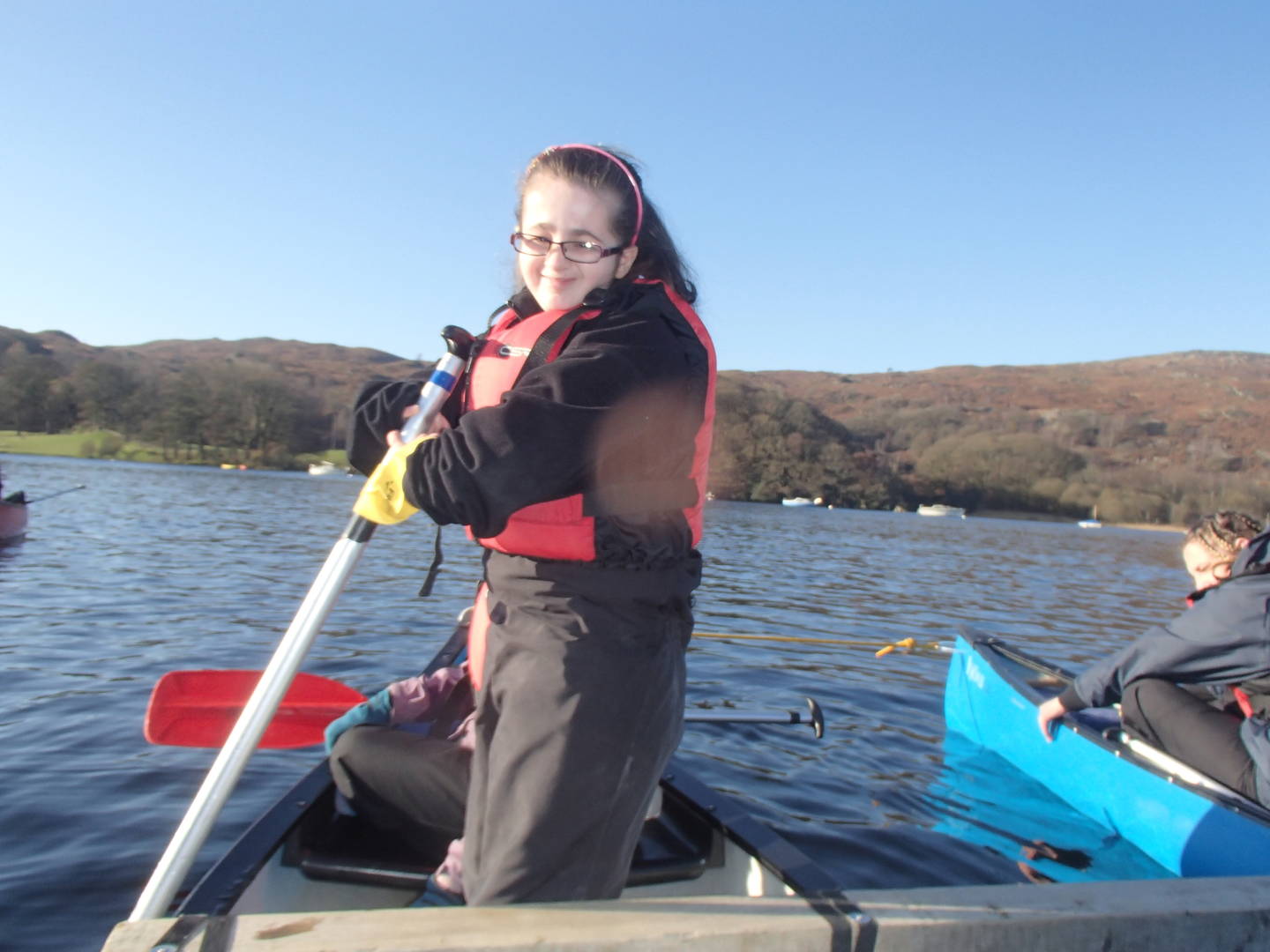 Sophie kayaking smiling to camera. 