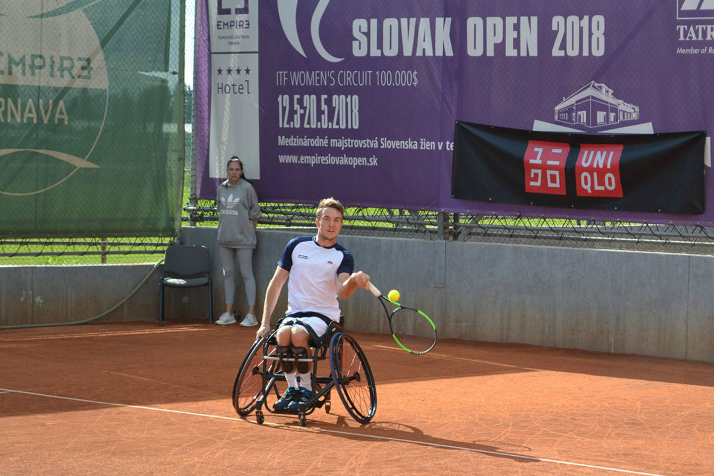 Dermot competing at a tennis match. 