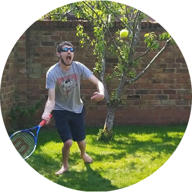 George playing tennis in garden