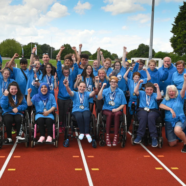 North West junior athletics team celebrating victory at National Championships 2019