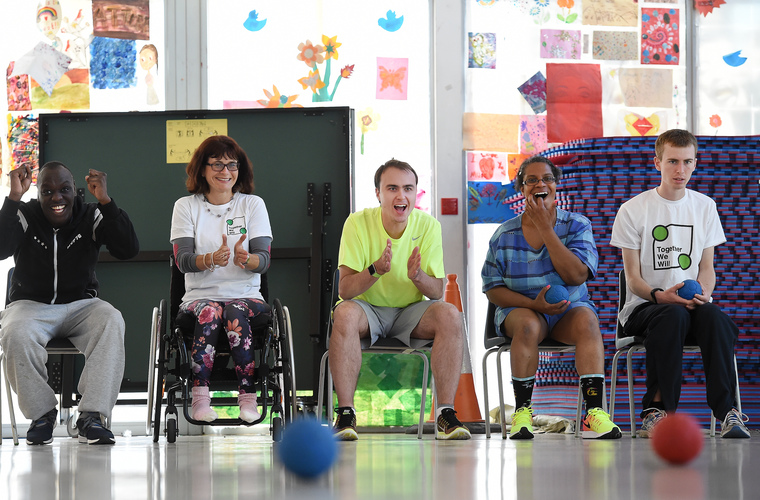 Group of disabled people having fun playing a game of Boccia