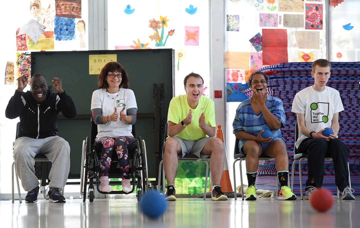 A group of disabled people having fun playing a game of Boccia