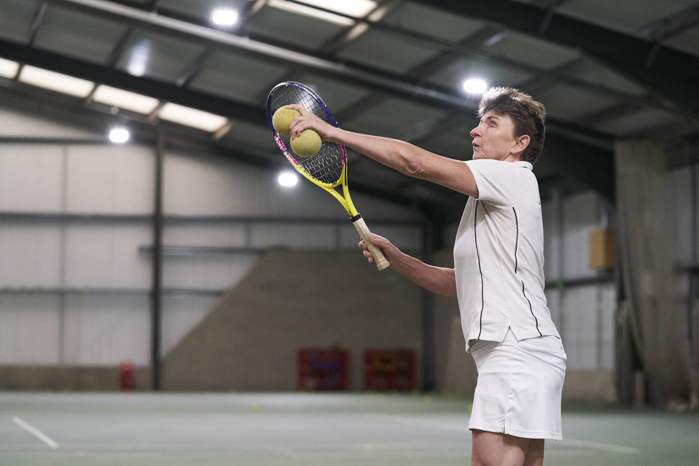 Visually Impaired woman playing tennis. Photo credit: Sport England