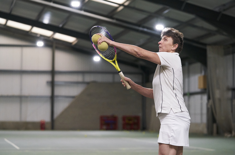 Visually Impaired woman playing tennis. Photo credit: Sport England