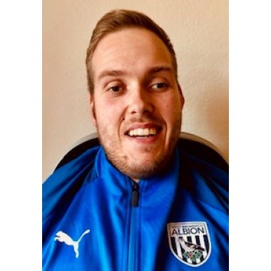 Headshot of Alex Giles, football coach