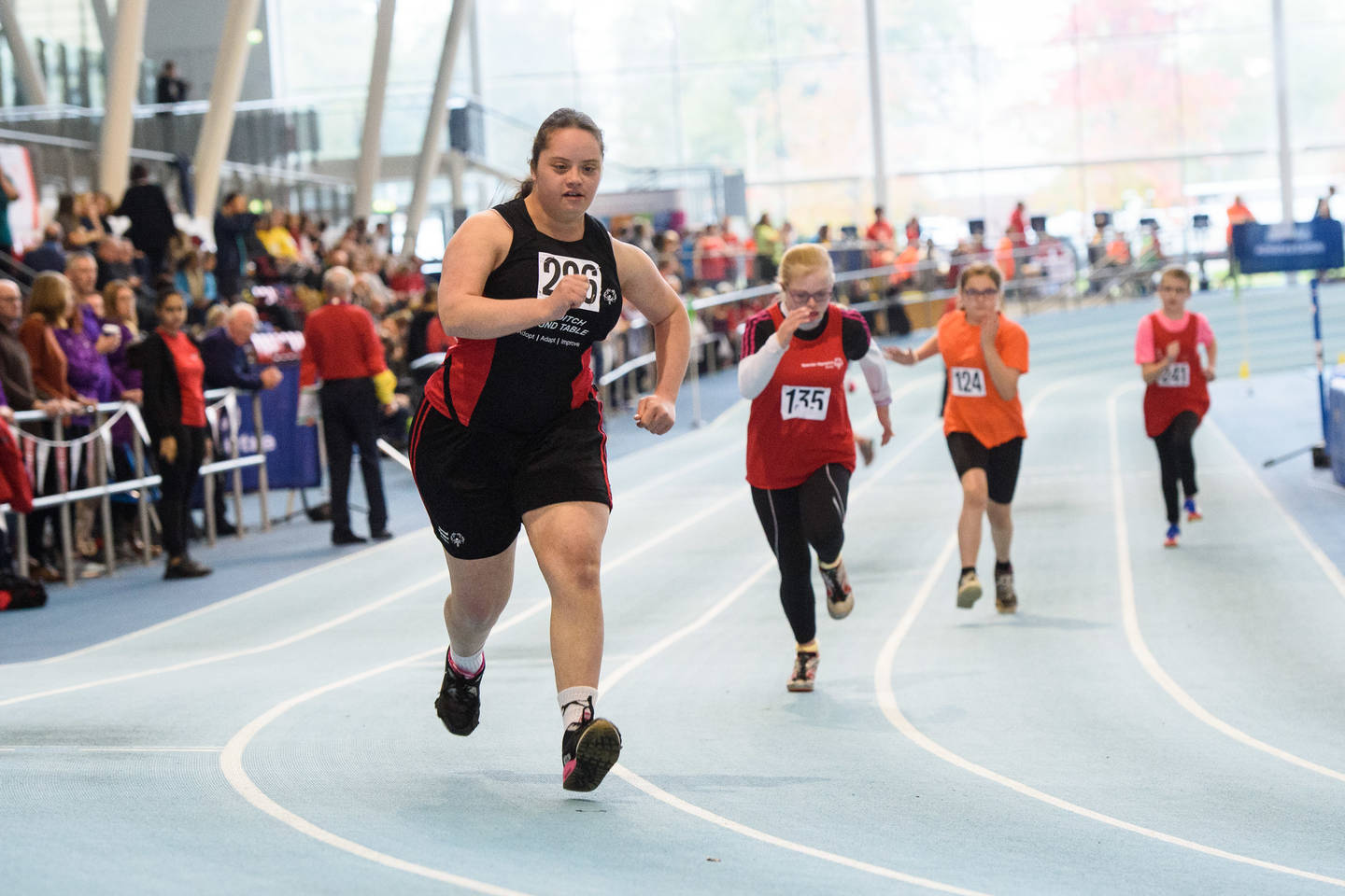 Special Olympics GB athletes competing in a race on an athletics track