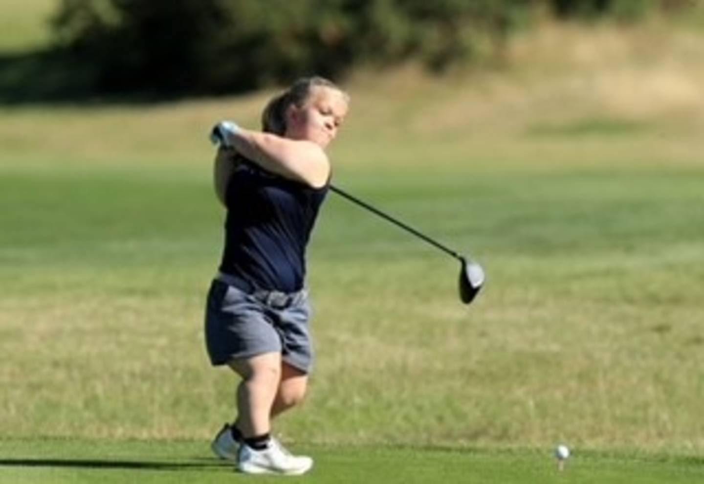 Ellie playing golf 