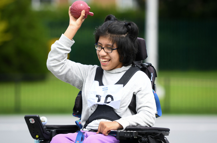 Young girl taking part in Activity Alliance's National Junior Athletics Championships in July 2021.