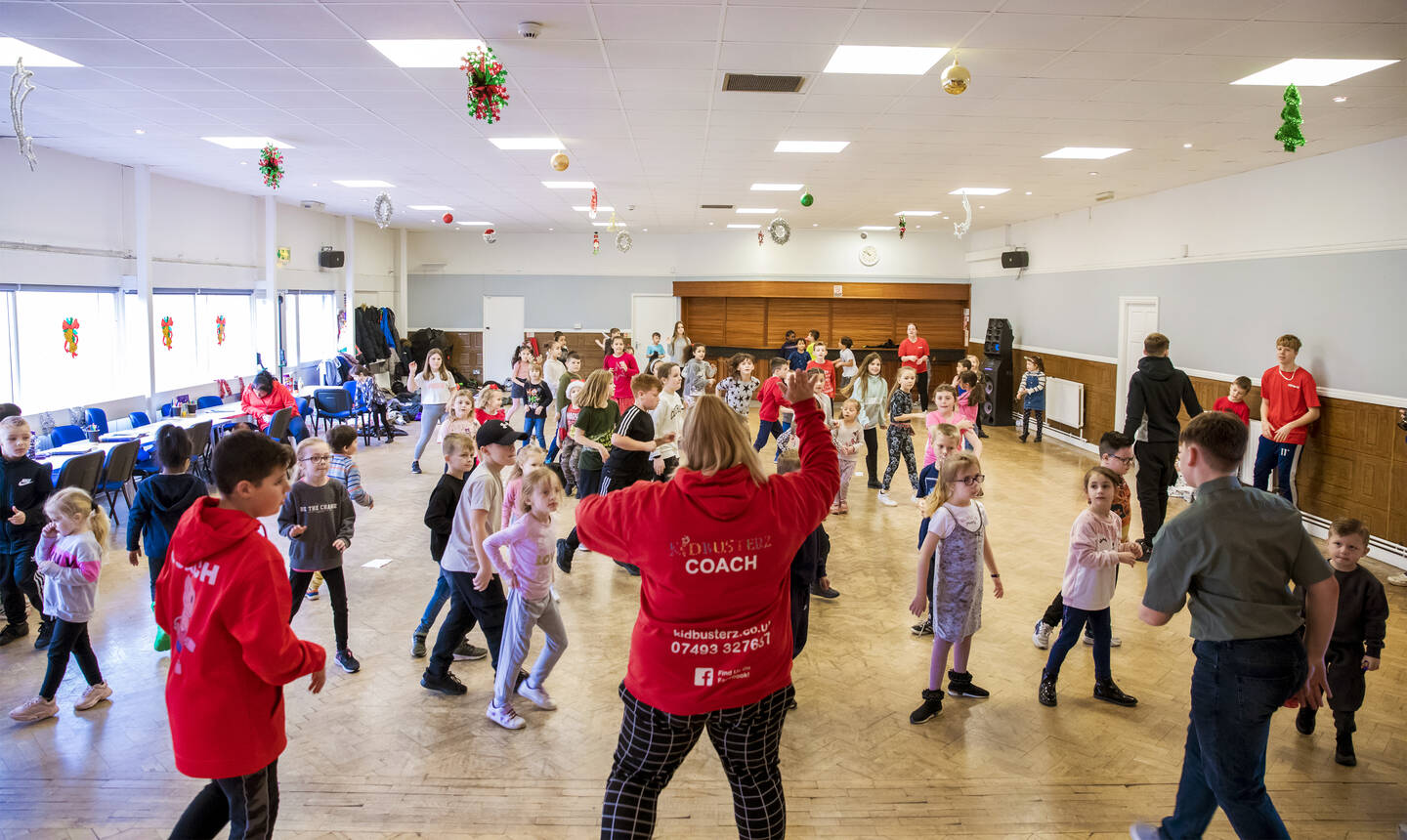 Group of children taking part in an exercise session.