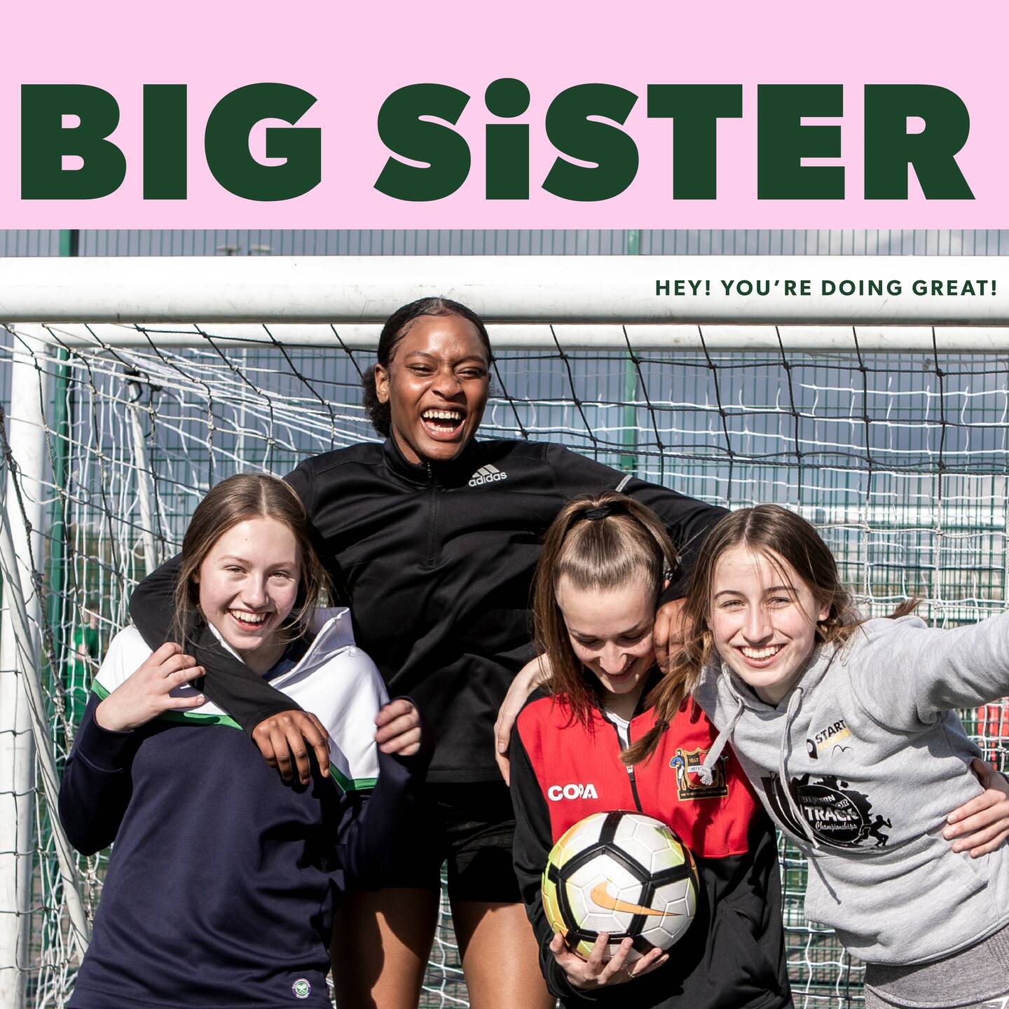 A group of girls smiling in front of a football net with text that reads Big Sister, hey you're doing great.