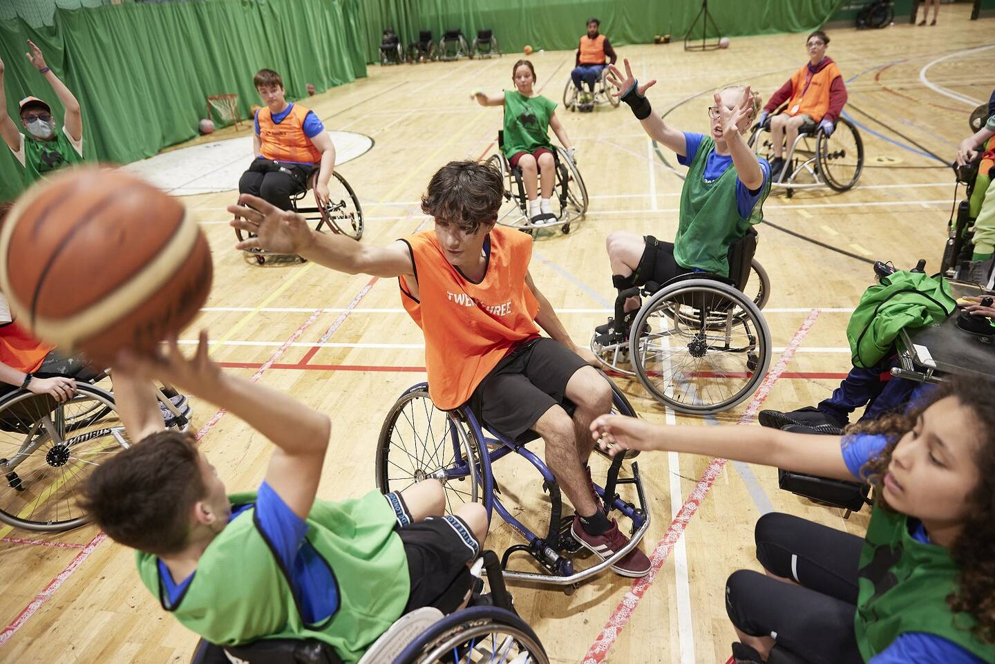Disabled children and young people playing wheelchair basketball at WheelPower National Junior Games 2022