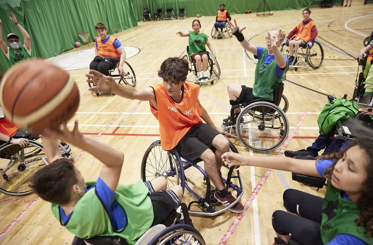 Disabled children and young people playing wheelchair basketball at WheelPower National Junior Games 2022