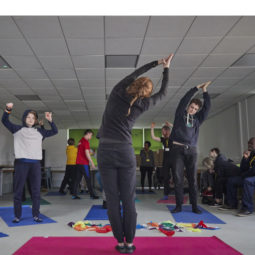 Young people with learning disabilities taking part in a yoga session