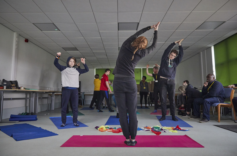 Young people with learning disabilities taking part in a yoga session