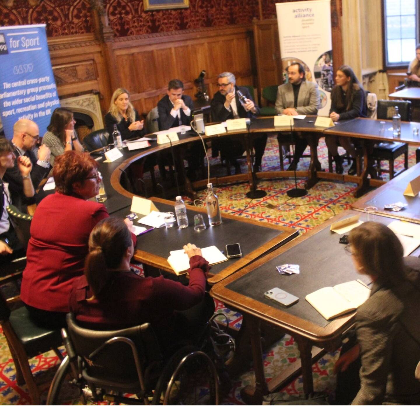 A group of leaders discussing disabled people's participation at parliament event