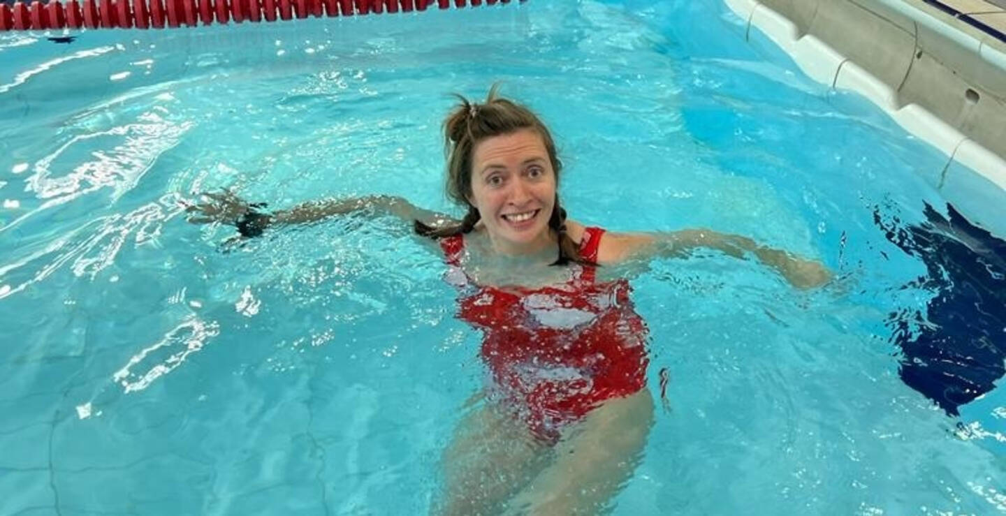 Laura in an indoor swimming pool. 