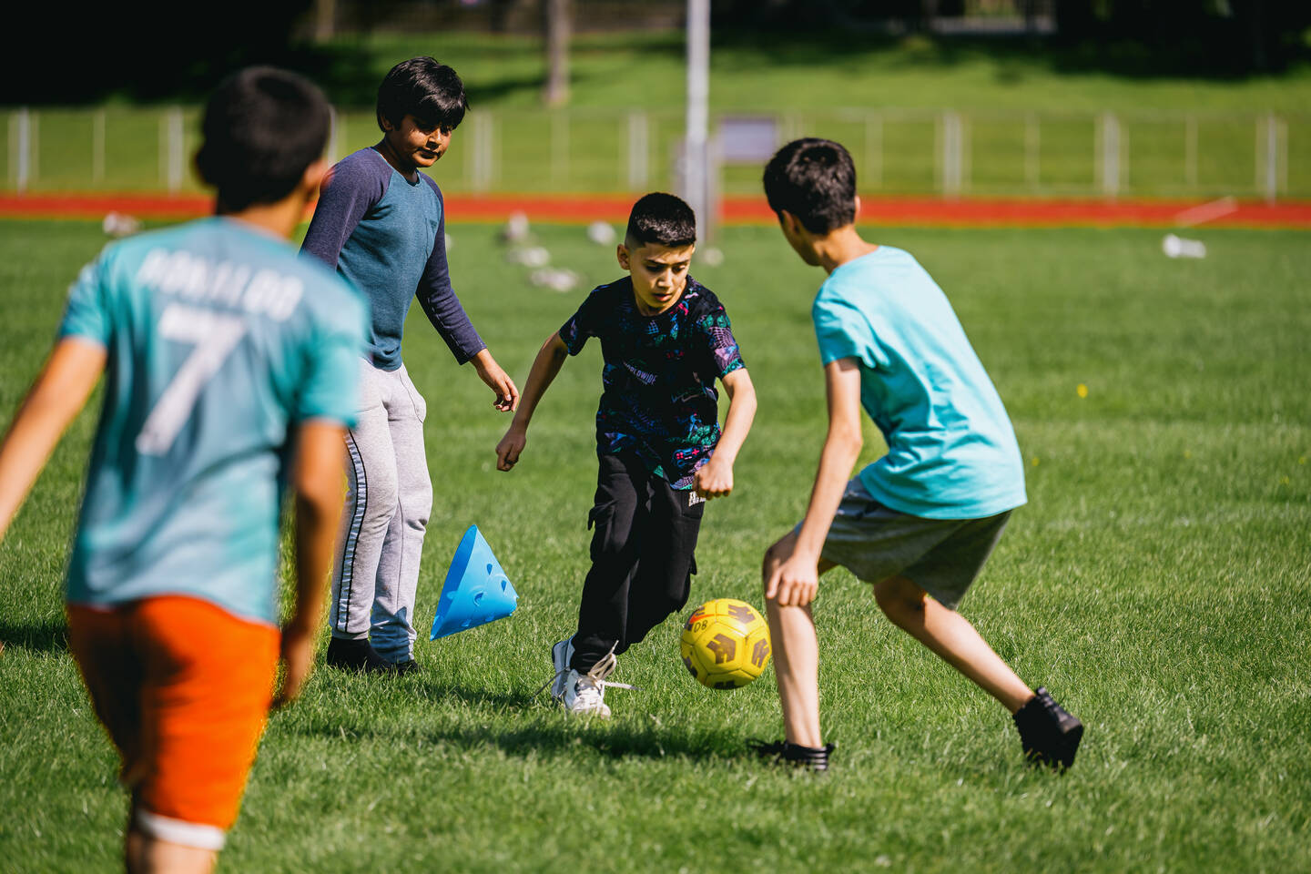 Group of young boys playing football