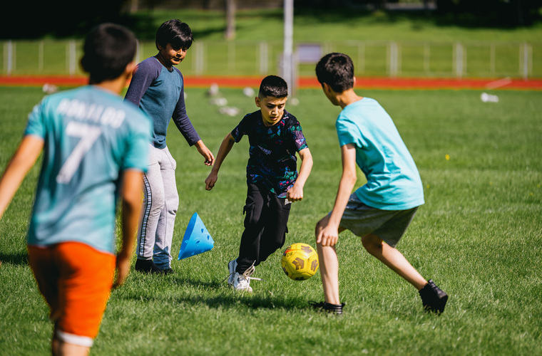Group of young boys playing football