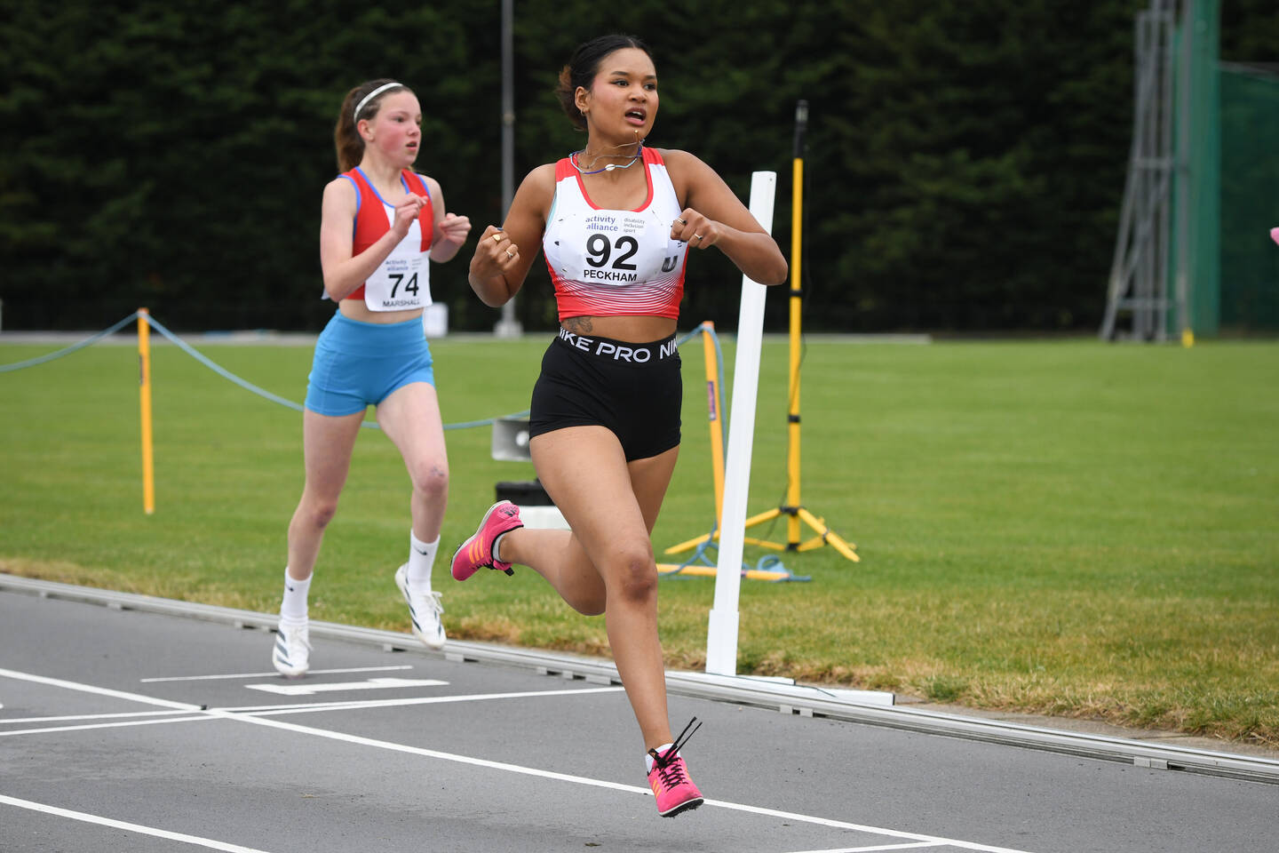 Girls running in an athletics event 2024