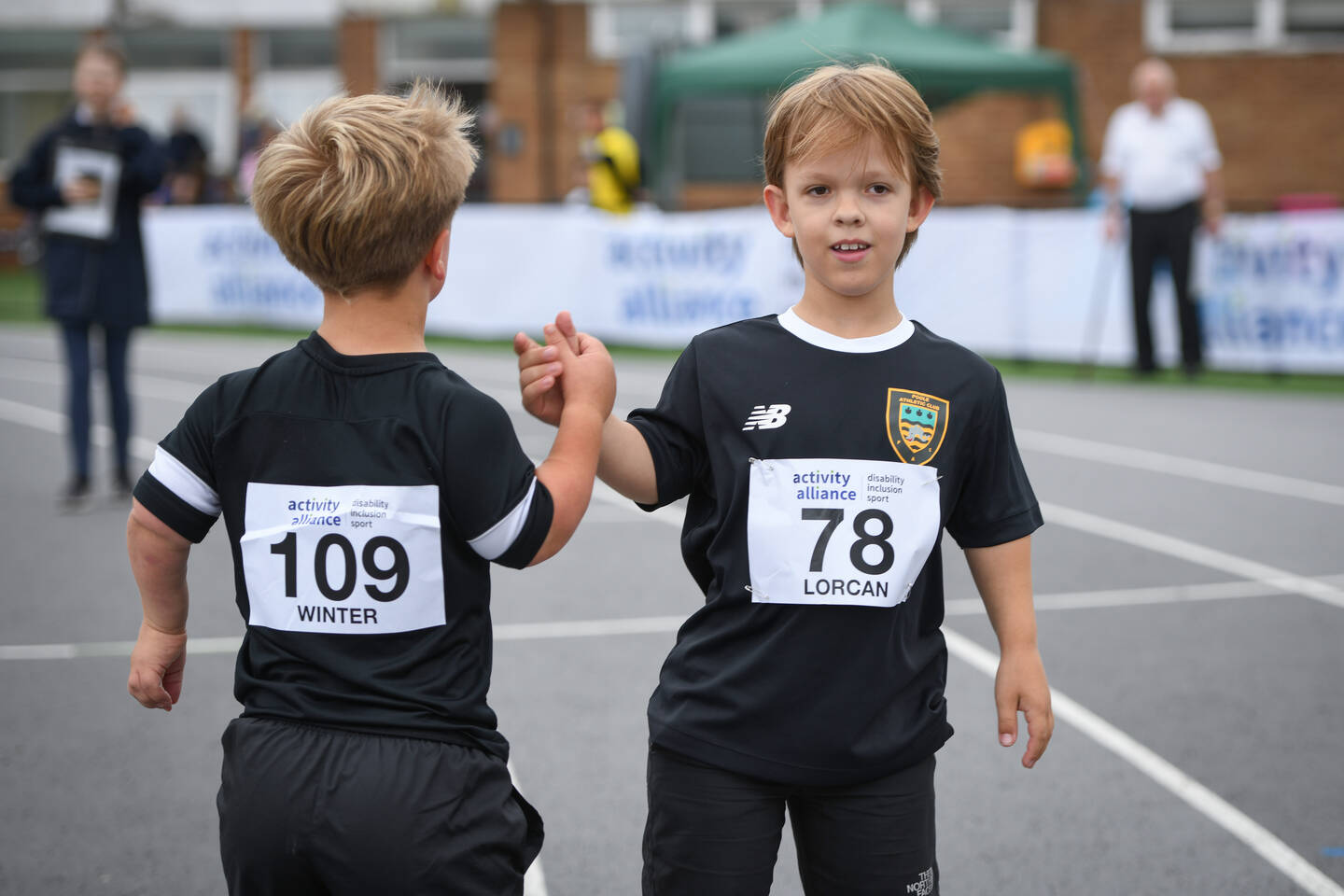 Two athletes congratulate each other at the National Junior Para Athletics Championships 2025.