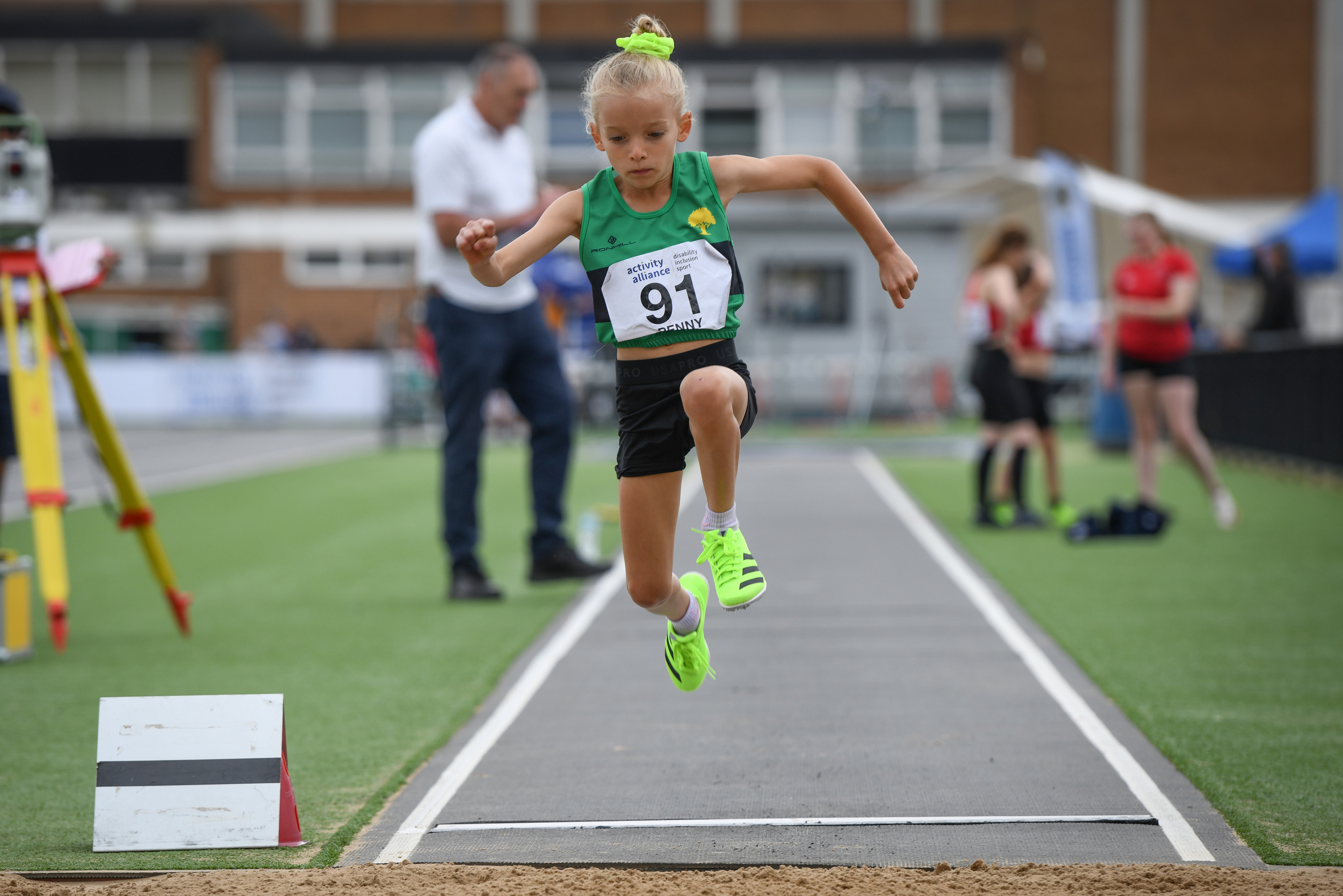 An athlete jumping in long jump