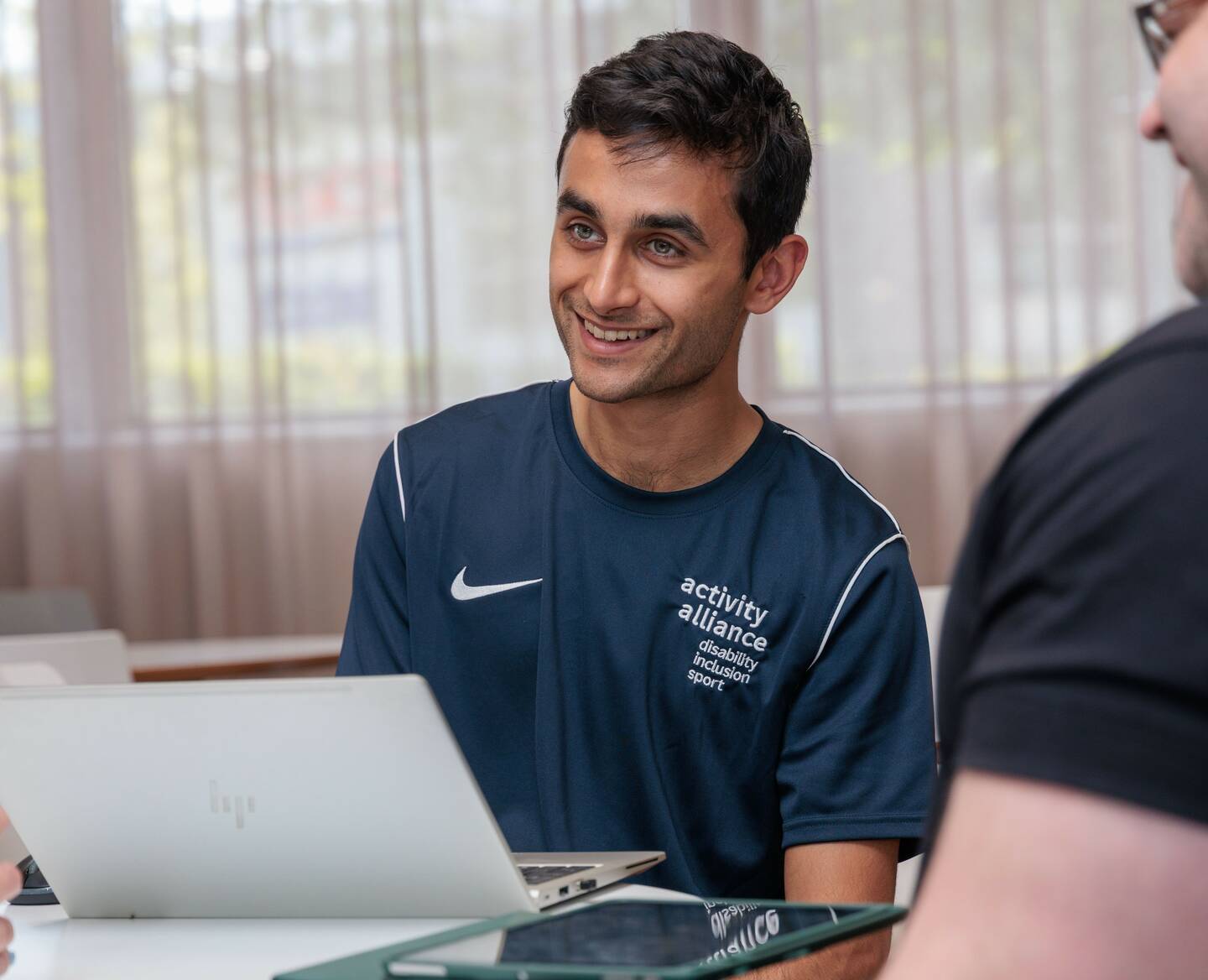 An Activity Alliance staff member smiles.